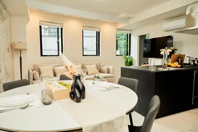 a dining room with a table and chairs at IoTele Minami-Aoyama in Tokyo
