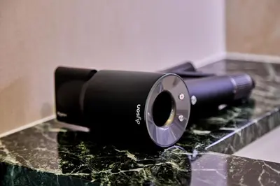 a black flashlight sitting on top of a counter at IoTele Minami-Aoyama in Tokyo