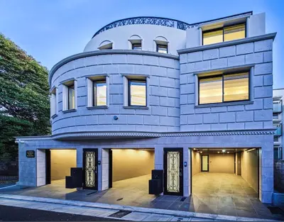 a house with a large garage in front of it at IoTele Minami-Aoyama in Tokyo