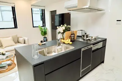 a kitchen with a sink and a counter top at IoTele Minami-Aoyama in Tokyo