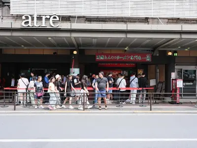 a group of people standing outside of a store at ESTABLISHMENT Ueno in Tokyo