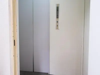 a white door with a control panel on it at ESTABLISHMENT Ueno in Tokyo
