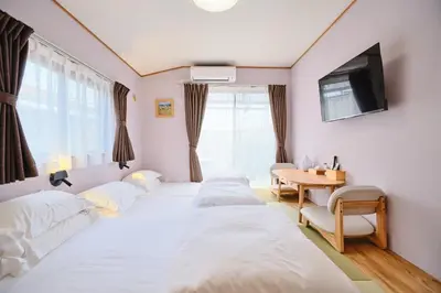 a room with three beds and a table and a tv at Tokoryokan - Takasago - Vacation STAY 20335v in Tokyo