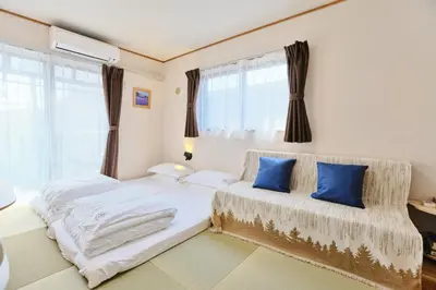 a bedroom with two beds and a window at Tokoryokan - Takasago - Vacation STAY 20335v in Tokyo