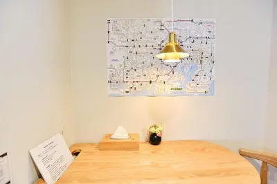 a map on the wall above a desk with a lamp at Tokoryokan - Takasago - Vacation STAY 20335v in Tokyo