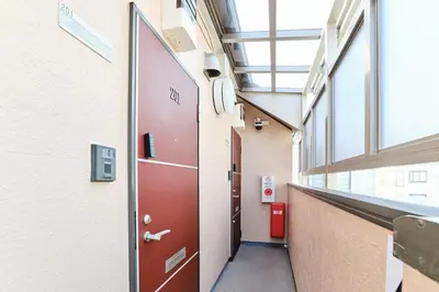 a corridor of a hospital hallway with a red door at Tokoryokan - Takasago - Vacation STAY 20335v in Tokyo