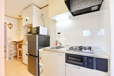 a kitchen with a stove and a refrigerator at Tokoryokan - Takasago - Vacation STAY 20335v in Tokyo