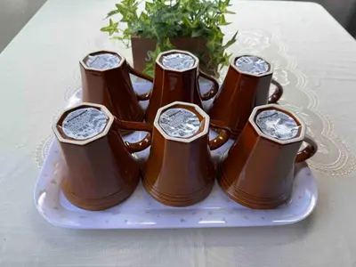 a group of brown bottles on a plate on a table at Direct to Akihabara Shinjuku Max 6 people in Tokyo