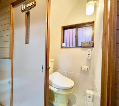 a bathroom with a toilet and a window at Direct to Akihabara Shinjuku Max 6 people in Tokyo
