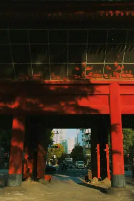 a red building with a street in the background at illi Rug Hamamatsucho in Tokyo