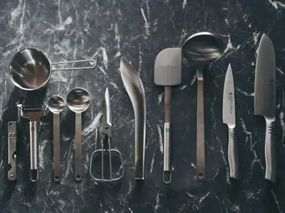 a bunch of kitchen utensils sitting on a table at illi Tria Shibuya in Tokyo