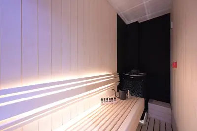 a bench in a room with a window at HOTEL MINATO Azabu-juban in Tokyo