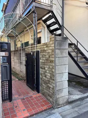 a building with a gate and a staircase on it at \u967d\u3060\u307e\u308a\u306e\u3046\u305f\u305f\u306d\u3053 in Tokyo