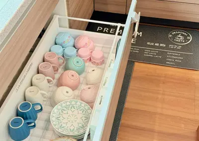 a box filled with different colored vases and cups at Sun inn \u4eac\u5cf6 in Tokyo