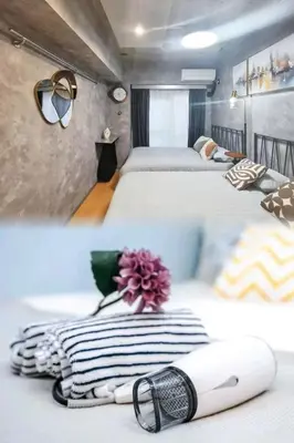 two beds in a room with two beds with towels at PA Shinjuku St a-9mins -Higashishinjuku subway-5mins-\u65b0\u5bbf-\u6b65\u884c\u4f0a\u52bf\u4e398\u5206-MAX4p in Tokyo