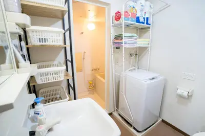 a small bathroom with a toilet and a sink at 7th floor 702 with elevator, Minato area, 40 square meters, near Tokyo Tower, direct train to Haneda Airport, Narita Airport in Tokyo