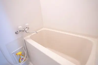 a white bath tub in a white room at 7th floor 702 with elevator, Minato area, 40 square meters, near Tokyo Tower, direct train to Haneda Airport, Narita Airport in Tokyo