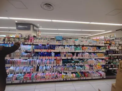 a person is taking a picture of a supermarket aisle at 7th floor 702 with elevator, Minato area, 40 square meters, near Tokyo Tower, direct train to Haneda Airport, Narita Airport in Tokyo