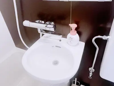 a bathroom with a toilet and a white sink at ksi\u5357\u5e38\u76e4\u53f0301 in Tokyo