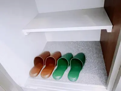 a row of three pairs of shoes in a closet at ksi\u5357\u5e38\u76e4\u53f0301 in Tokyo