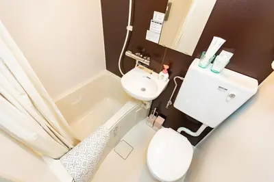 a small bathroom with a toilet and a sink at ksi\u5357\u5e38\u76e4\u53f0301 in Tokyo