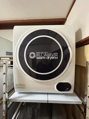 a microwave oven on a shelf in a room at Unique house mixed Japanese and European old style in Tokyo