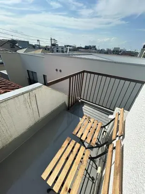 a balcony with a wooden bench on a roof at Unique house mixed Japanese and European old style in Tokyo