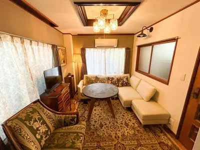 a living room with a couch and a table at Unique house mixed Japanese and European old style in Tokyo