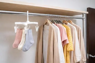 a closet with a rack of clothes and socks at 7th floor 701 with elevator 40 square meters in the port area, close to Tokyo Tower, direct access to Haneda Airport in Tokyo
