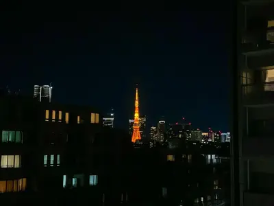 a view of the eiffel tower lit up at night at 7th floor 701 with elevator 40 square meters in the port area, close to Tokyo Tower, direct access to Haneda Airport in Tokyo
