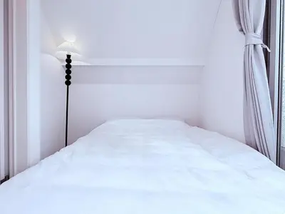 a white bedroom with a bed and a lamp at Yodamari House Ikebukuro Direct access to Shinjuku and Shibuya7 people OK! in Tokyo