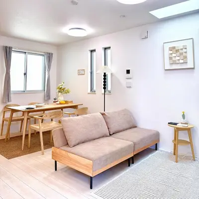a living room with a couch and a table at Yodamari House Ikebukuro Direct access to Shinjuku and Shibuya7 people OK! in Tokyo