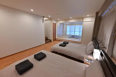 a hotel room with two beds and a window at Skytree Luxury Villa - 2025 New, to Skytree, Direct Airport Access in Tokyo