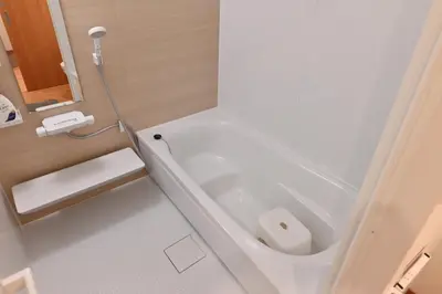 a small bathroom with a tub and a toilet at Skytree Luxury Villa - 2025 New, to Skytree, Direct Airport Access in Tokyo