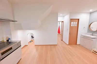a kitchen with white walls and a wooden floor at Skytree Luxury Villa - 2025 New, to Skytree, Direct Airport Access in Tokyo