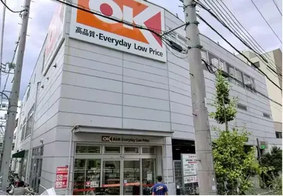 a building with a sign on the side of it at I HOUSE jujo in Tokyo
