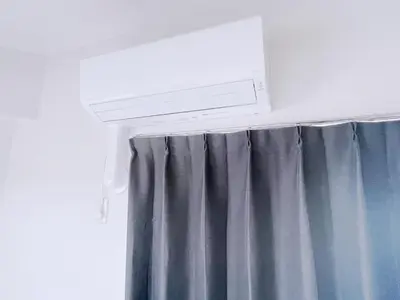 a window with a curtain and a air conditioner at ksi\u5357\u5e38\u76e4\u53f0302 in Tokyo