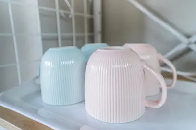 three white vases are sitting on a shelf at 425Room,Newly renovated 20 square meters in Shibuya 6 minutes walk to Shibuya with direct access to multiple lines in Tokyo