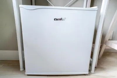 a white refrigerator sitting in a room at 425Room,Newly renovated 20 square meters in Shibuya 6 minutes walk to Shibuya with direct access to multiple lines in Tokyo
