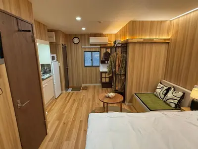 a small room with a bed and a table at TOKYO SKYTREE HOUSE-Multiple room styles in Tokyo