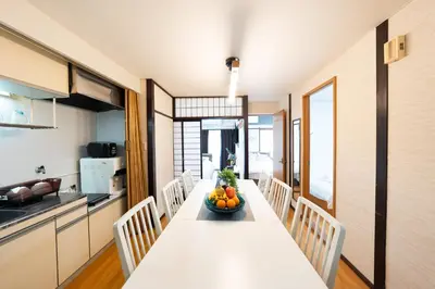 a kitchen with a table with a bowl of fruit on it at 50 \u5e73\u65b9 - \u65b0\u5bbf 1 \u7ad9\u5730 - \u65b0\u5927\u4e45\u4fdd\u7ad9 4 Min - \u6b4c\u821e\u4f0e\u753a 4 Min - Sakura 404 in Tokyo