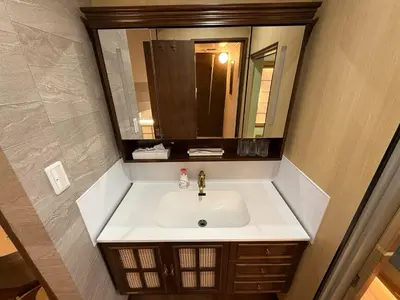 a bathroom with a sink and a mirror at TOKYO SKYTREE VILLIA-Whole villia space perfect for families and groups in Tokyo
