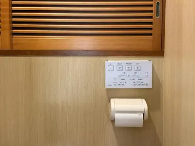 a toilet paper dispenser with a roll of toilet paper at TOKYO SKYTREE VILLIA-Whole villia space perfect for families and groups in Tokyo