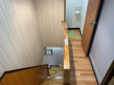 a staircase in a house with wooden floors at TOKYO SKYTREE VILLIA-Whole villia space perfect for families and groups in Tokyo