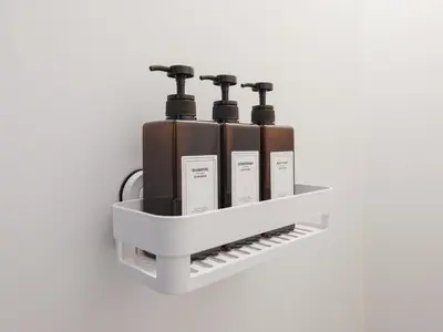 a shelf with four wine bottles on a wall at \u30bc\u30a6\u30b9\u6c60\u4e0a Zeus Ikegami in Tokyo
