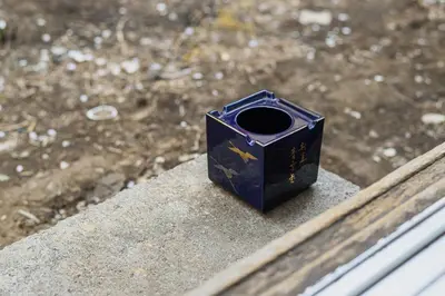 a blue box sitting on top of a ledge at Cube Sangenjaya in Tokyo