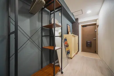 a staircase in a room with a hallway at 2 Minutes Walk to Ikebukuro Station, Modern Stay, Very Convenient in Tokyo