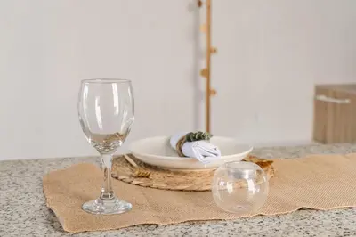 a table with a wine glass and a plate of food at Casa di Luce - Stylish Stay near Shibuya & Meguro River Room405 in Tokyo