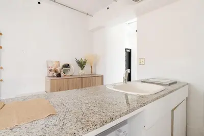 a bathroom with a sink and a counter top at Casa di Luce - Stylish Stay near Shibuya & Meguro River Room405 in Tokyo