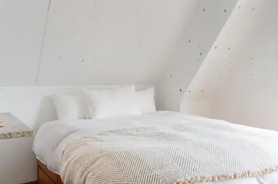 a white bed with white sheets and pillows at Casa di Luce - Stylish Stay near Shibuya & Meguro River Room405 in Tokyo